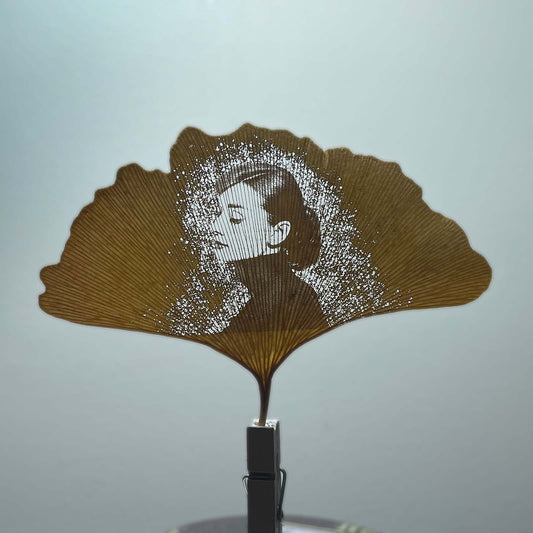 Audrey Hepburn's face on a ginkgo leaf